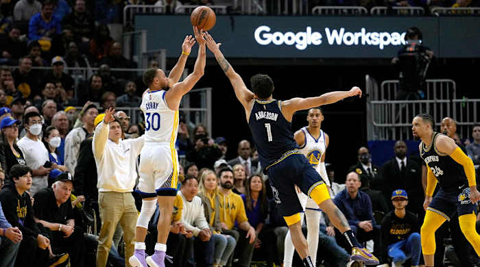 Golden State Warriors guard Stephen Curry (30) takes a 3-point shot over Memphis Grizzlies forward Kyle Anderson (1) during the second half of Game 4 of an NBA basketball Western Conference playoff semifinal in San Francisco, Monday, May 9, 2022. The Warriors won 101-98.